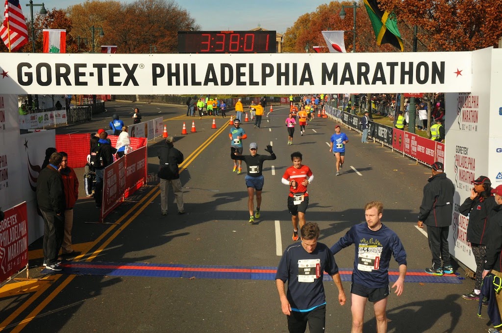Me crossing the finish line of the 2014 Philadelphia Marathon
